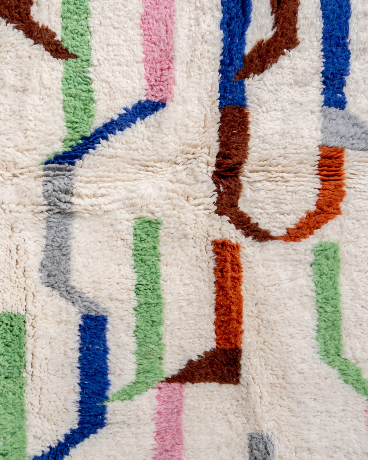Modern, designer, handcrafted Berber rug from Morocco. Beniourain carpet with beautiful colours and patterns and fluffy wool texture.